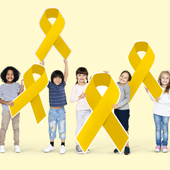 A full shot of Kids holding gold ribbons against a light lime yellow background.